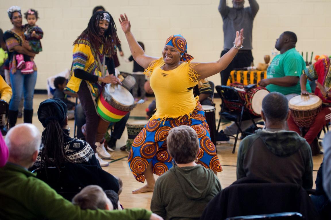 Performers with the African Heritage Dancers and Drummers hold a Kwanzaa celebration hosted by the Smithsonian Anacostia Community Museum at Fort Stanton Recreation Center in Washington, DC, December 27, 2017